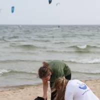 two students pick up trash